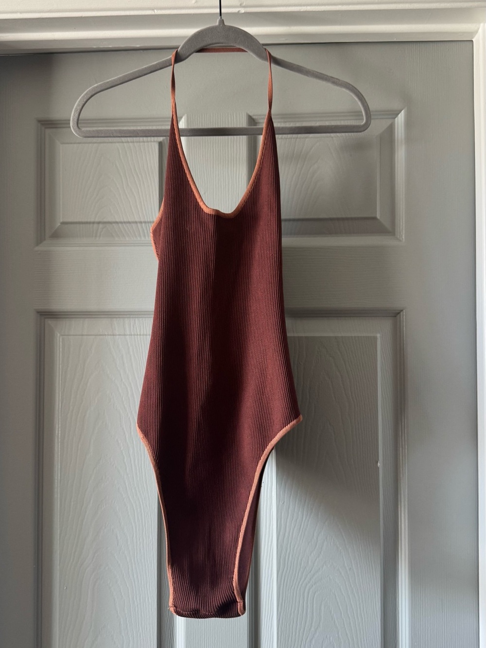 Hanifa Ribbed Halter Bodysuit in Rust with Peach Trim